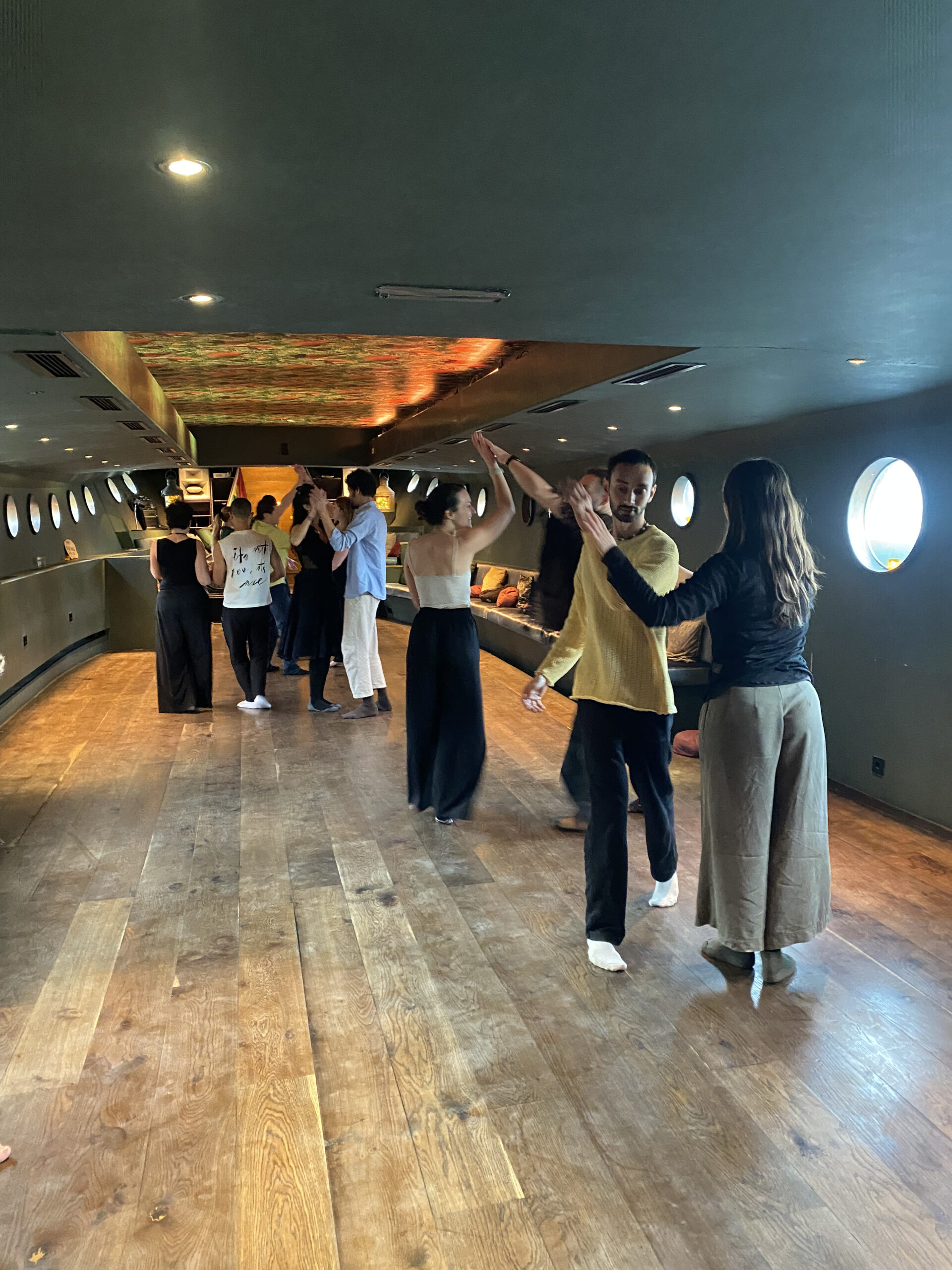 Participants exploring partner movement in a Contact Beyond Contact workshop